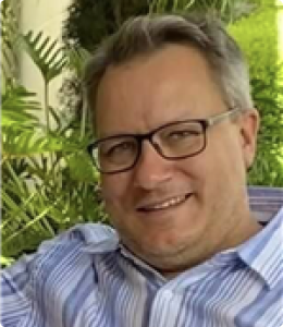 older gentleman with black glasses